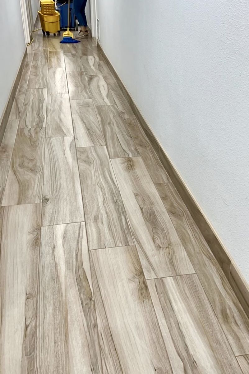Wood-look vinyl hallway floor after acid wash